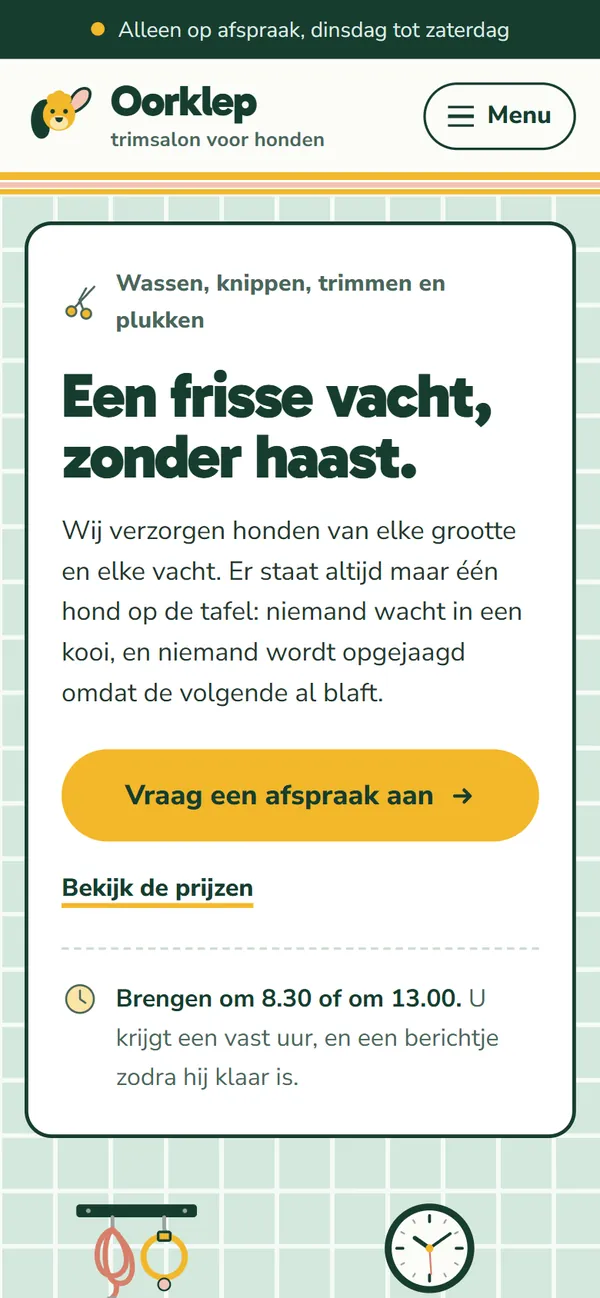 De homepagina in de website voor een hondentrimsalon, het begin van de pagina op een gsm